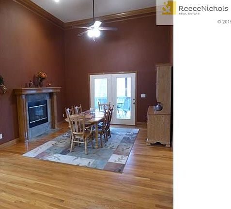 Huge Hearth Room currently used as eating area w/ access to covered deck.