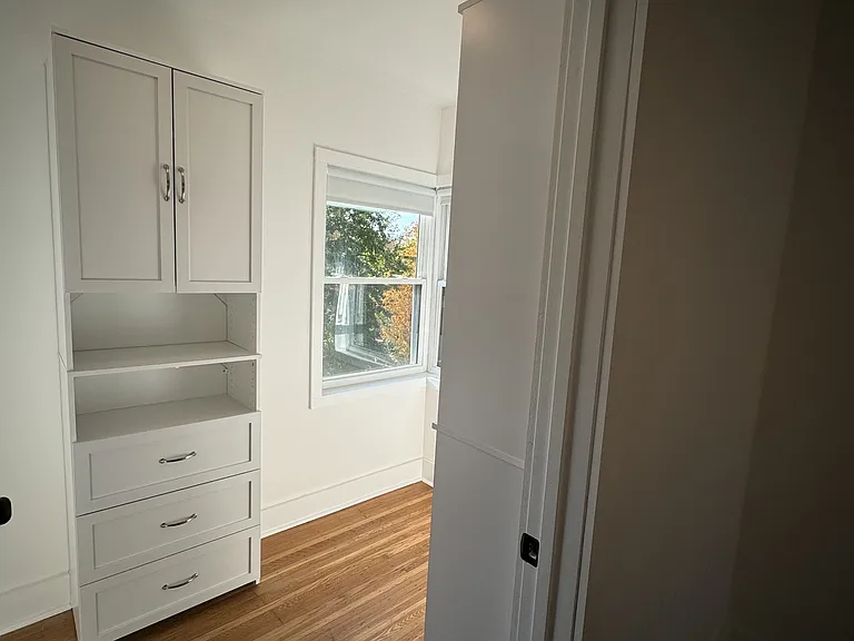 Walk-in closet with built in storage.