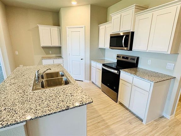 Kitchen - All Home and community information, including pricing, included features, terms, availability and amenities, are subject to change at any time without notice or obligation. All Drawings, pictures, photographs, video, square footages, floor plans, elevations, features, colors and sizes are approximate for illustration purposes only and will vary from the homes as built.
