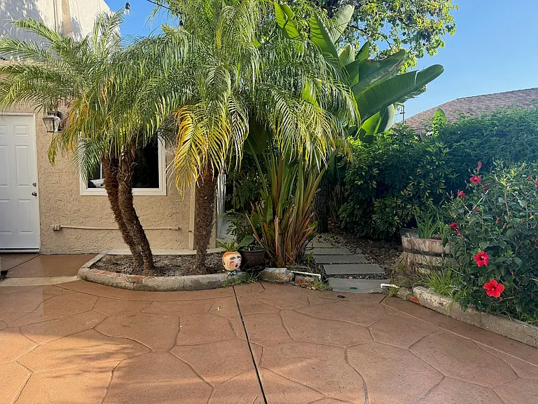 Private entrance with mature foliage
