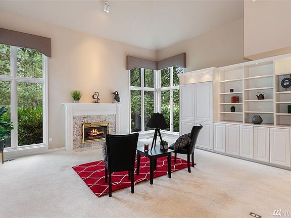 Floor to ceiling windows bring the outside into your living room. 