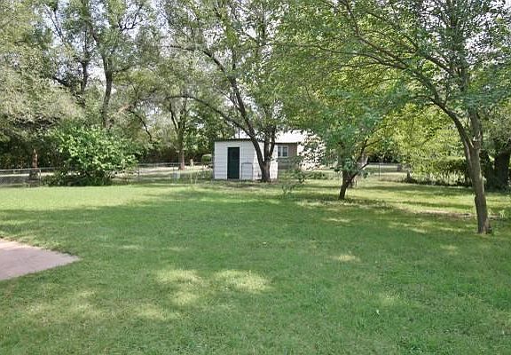 Fenced yard with shed