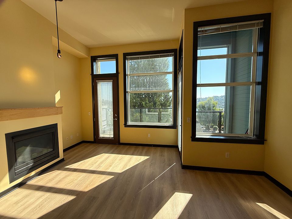 Living room with 12 ft ceilings, gas fireplace