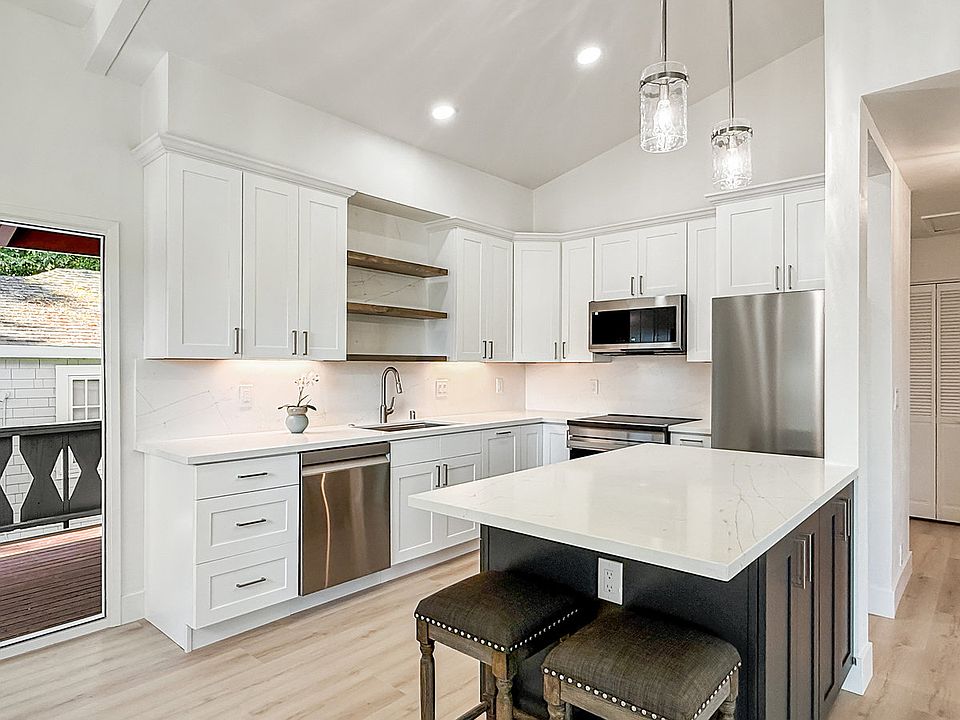 new kitchen with large island (stools included)
