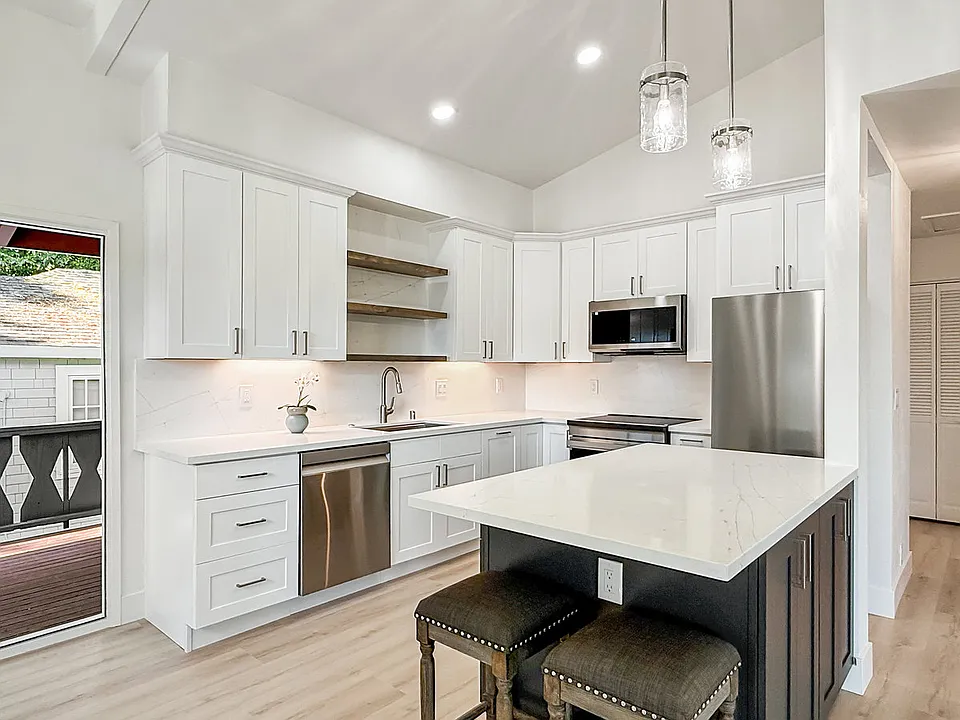 new kitchen with large island (stools included)