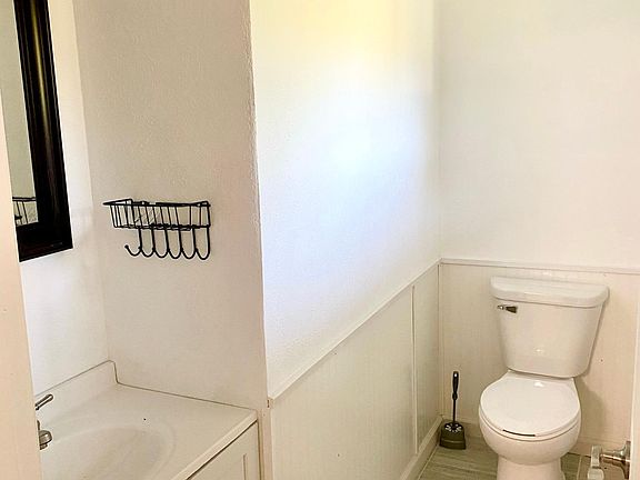 Half bath is right off the kitchen and near the Breezeway and Garage