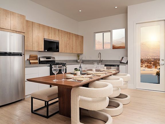 Apartment kitchen and dining area at Otonomus Las Vegas