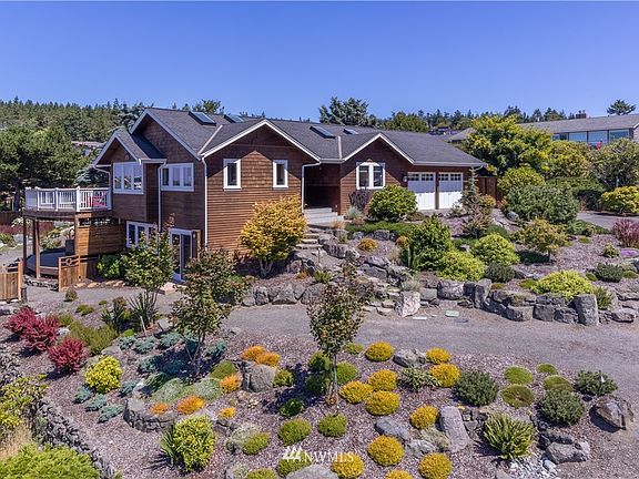 Main level of 2160sft uses the double garage; and lower driveway can be used for lower finished level of 1392sft. Notice the separate lower entrance under the upper kitchen windows.