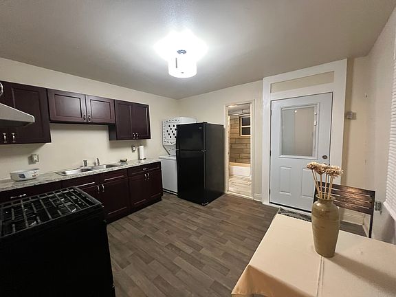 Eat in kitchen with stove, fridge, washer and dryer and new cabinets