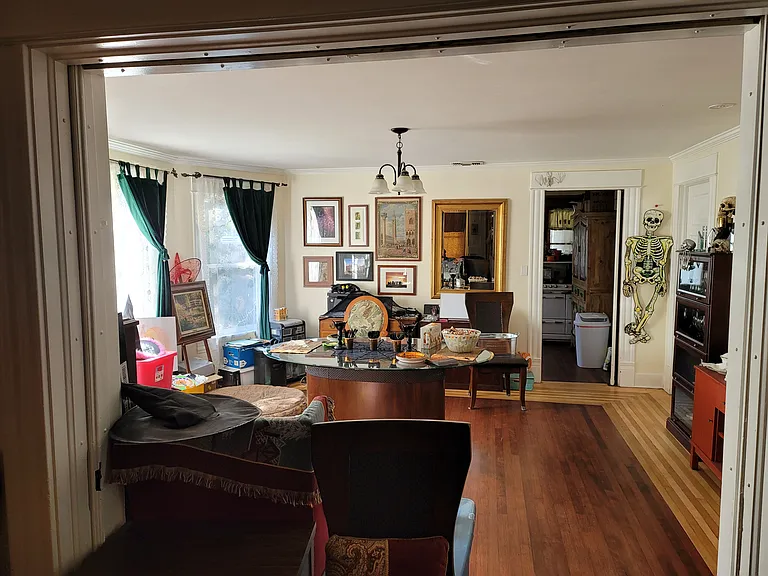 dining room from the living room. you can see kitchen door in back right open