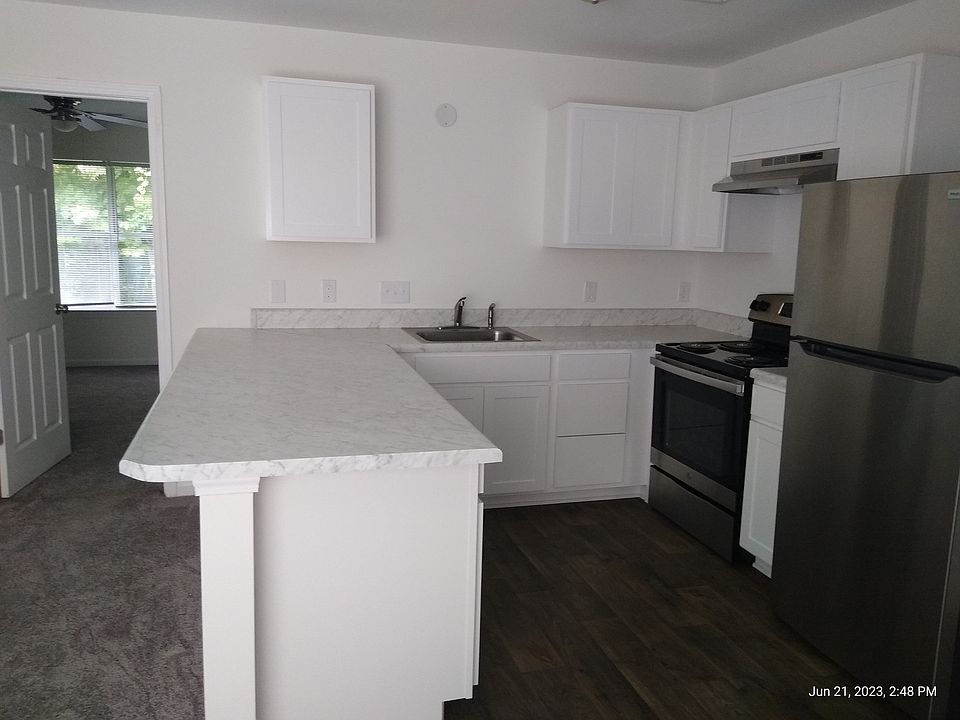 Renovated kitchen with white cabinets