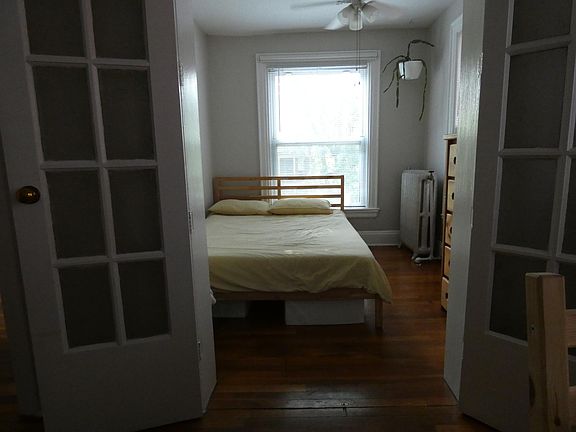 bed area with doors open