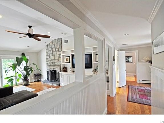 Front hall view to the family room and foyer