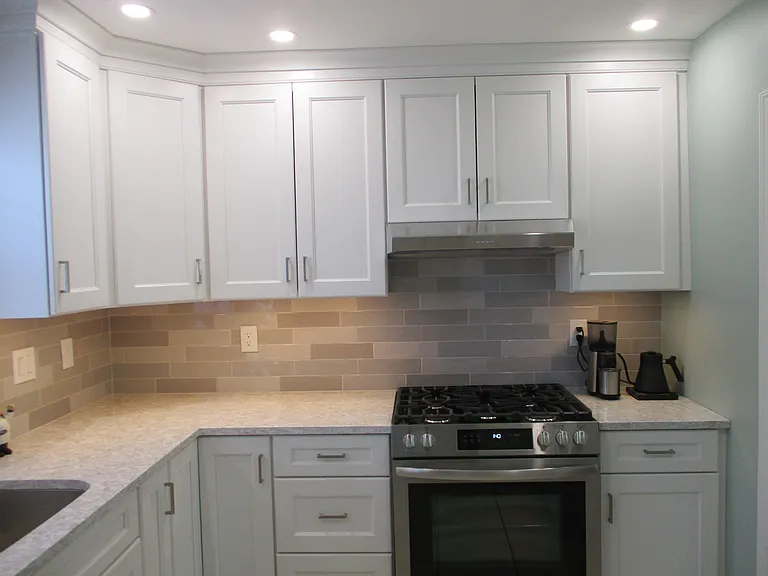New Kitchen with Natural Gas Range and Quartz Countertops