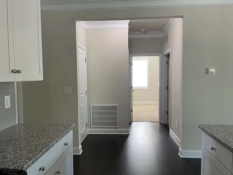 Hall to garage, middle bedroom and laundry.