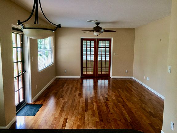 Living room looking towards sunroom with sunroom doors closed