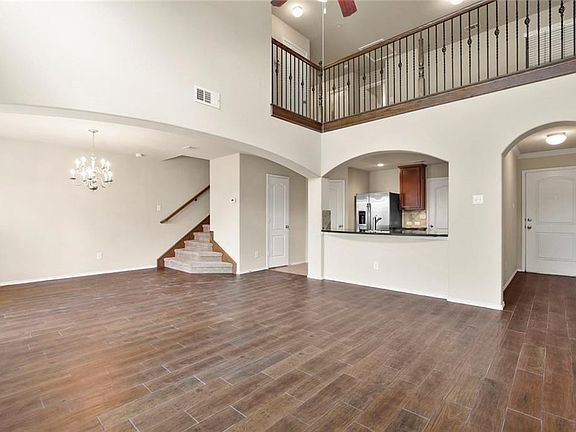 Bright and Airy. Wrought Iron Bannisters in Upstairs Game Room Overlooking Living Area