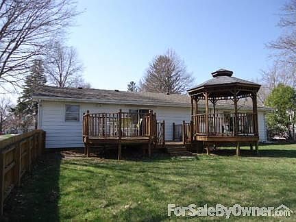 Back view from fenced backyard : Large deck and gazebo.