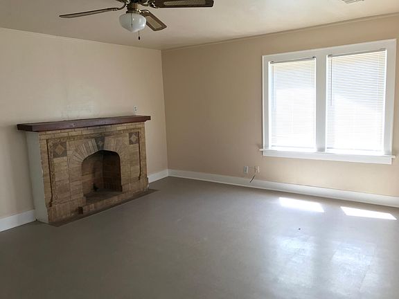 Living room with fireplace in view