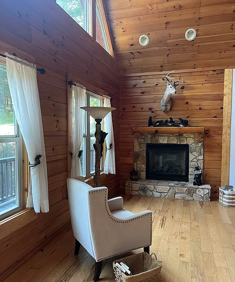 Gas fire place has an exterior vent. This is our "great room". Beautiful spot for photos and cozy for winter. We do have a central A/C and heating system...fireplace is not needed for heating but it's nice to warm by.