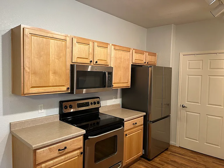 Kitchen left view of appliances.