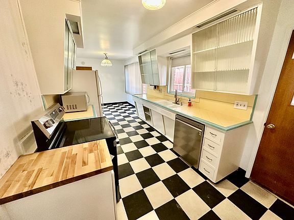 Lots of storage space in kitchen with microwave.