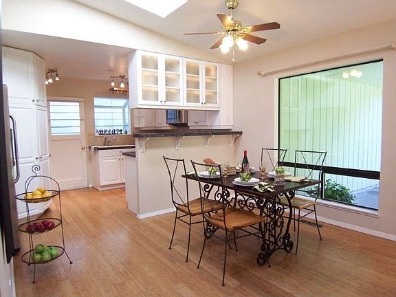 Generous dining space w/cathedral ceilings, skylights, bamboo hardwoods, breakfast bar with overhead