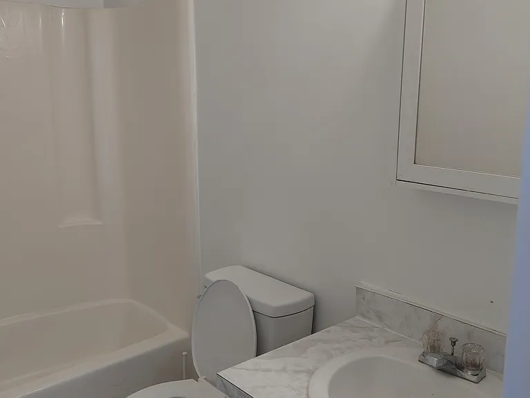Second floor bathroom with tub and shower