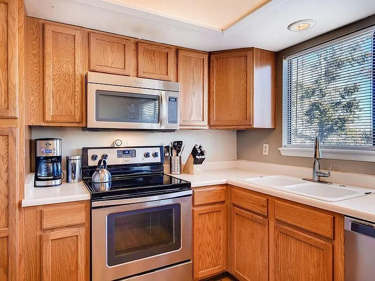 Kitchen with stainless steel appliances.