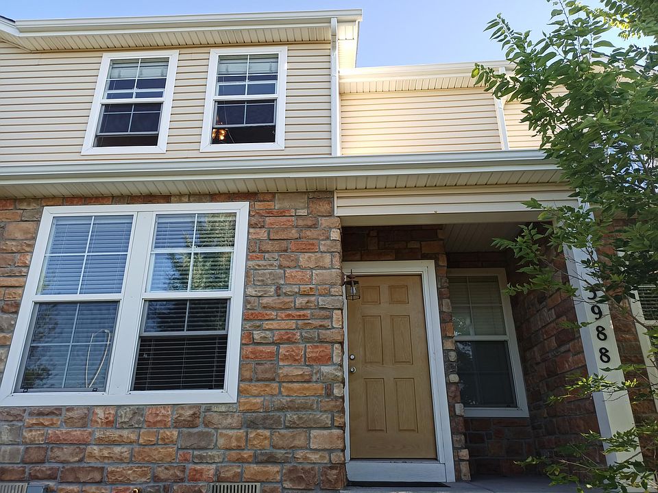 Front door showing living room, dining room, and Master bedroom windows,