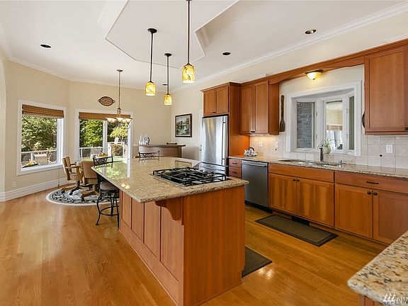 Blown glass pendant lights adorn the open concept kitchen.