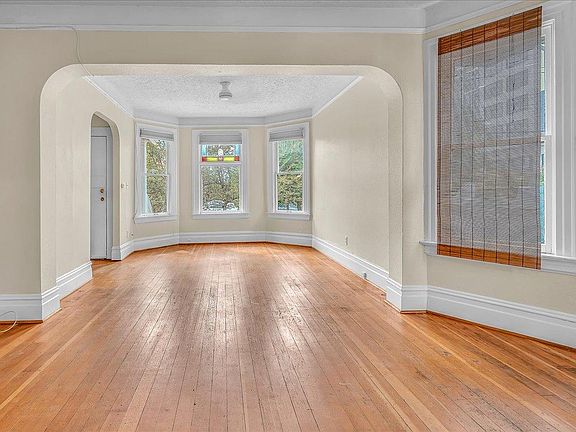 Living room with bay windows