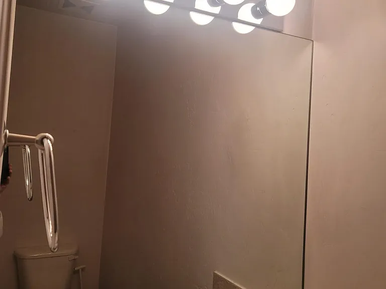 Half bathroom next to laundry and master bedroom