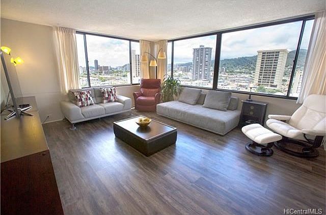 City views surround you from your light and bright living room.