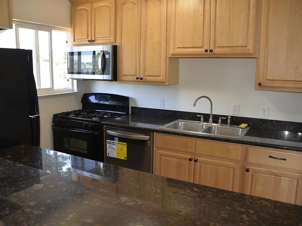 Kitchen - New Dishwasher, Microwave. Existing appliances include fridge, range, garbage disposal.
