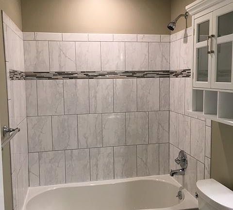 One of 2 full New tiled bath