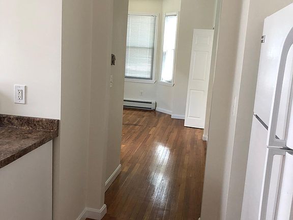 This view shows the entrance to the Living Room from the Kitchen. The front door entrance is in the living room.