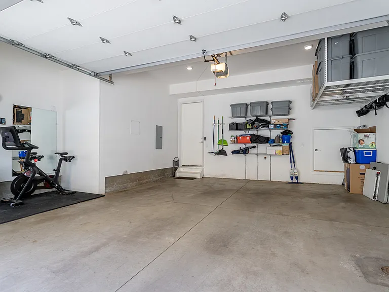 Oversized 2 car garage with extra storage and workout space