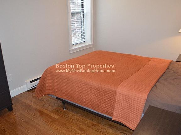 Spacious bedroom fits a Queen sized bed