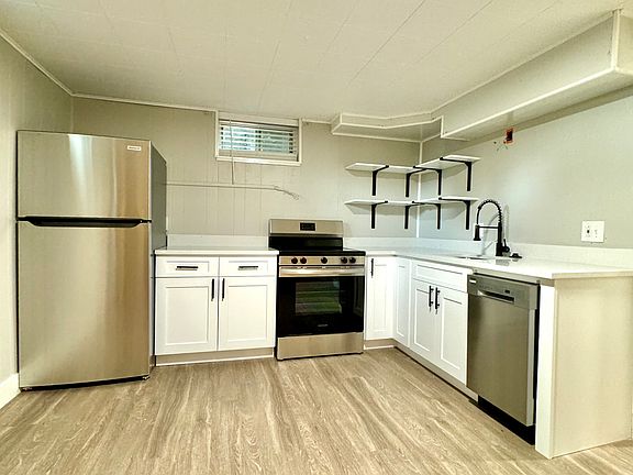 Stainless Steel Appliances, New Cabinets and Quartz Countertops