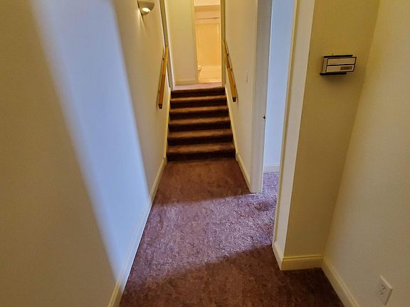 Hallway to bath and to 2 bedrooms