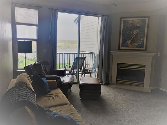 Living room with balcony view - new carpet and paint