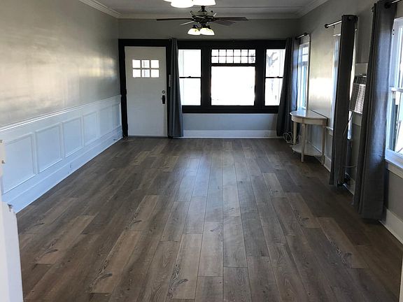 Living room/great room with large picture window.