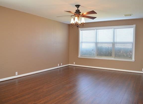 All downstairs windows are framed with trim and complete with gorgeous new wood floors and updated l