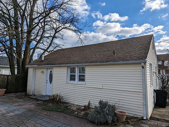 Private living with shared access to large paver patio.