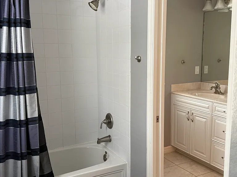 Second Full Bath with dual sinks and pocket door to seperate room with shower and toilet