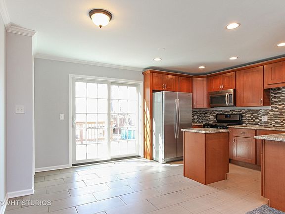 Kitchen has space for a table, patio doors that lead to the back deck.