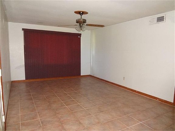 Large formal living room with ceramic tile floors