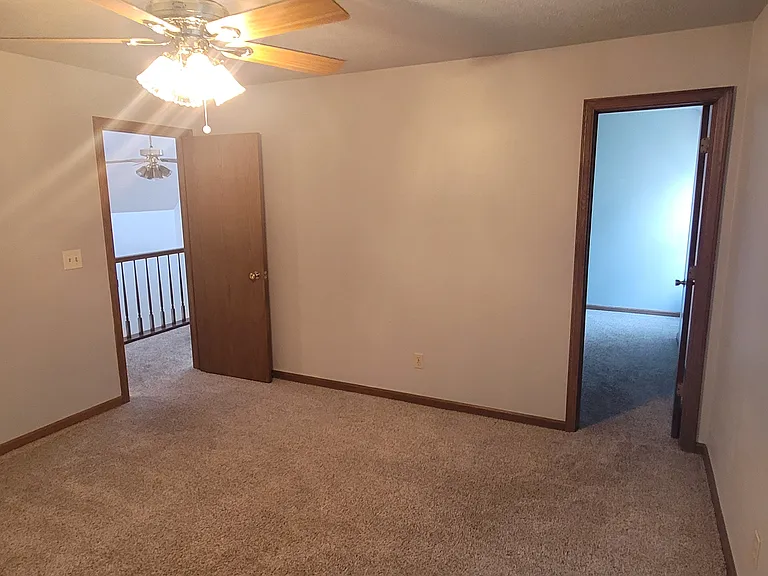 Look from the bedroom to the outside hall and the closet.