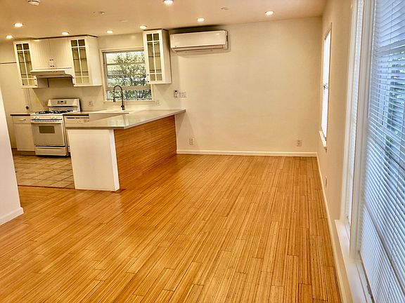 Living room into Dining w/ AC, and Passthrough to Kitchen